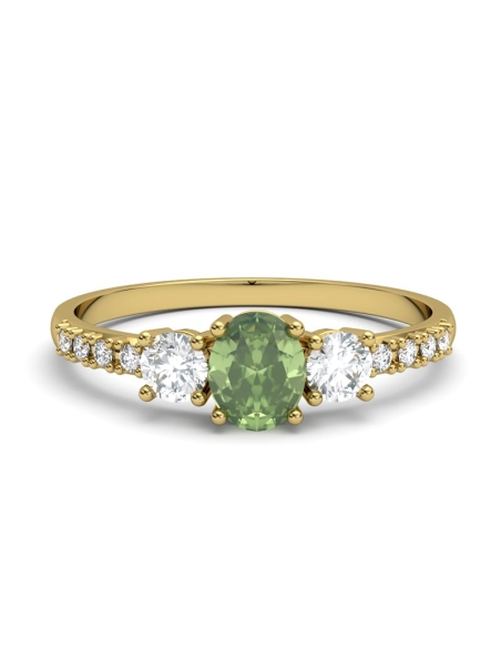 ANILLO OSIRIS DE ORO Y TOPACIOS BLANCOS CON 2 GARRAS DE 3MM Y CENTRO EN PERIDOTO DE 5X4MM